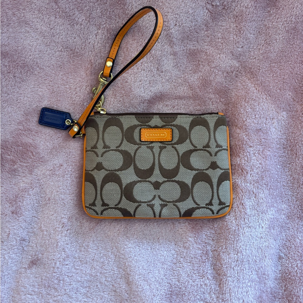 Orange Coach canvas wristlet